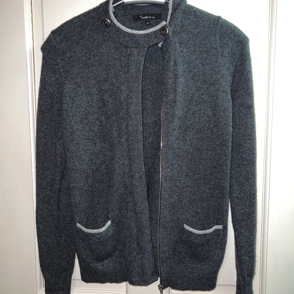 100% cashmere with zip front.